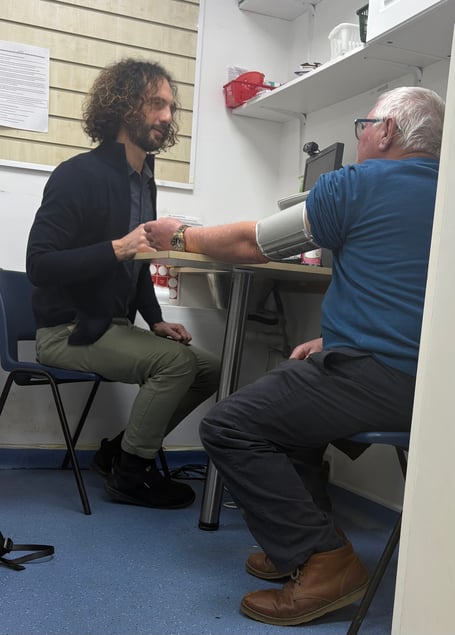 Pharmacist Marco Coluccia with member of the public Trevor Jones having his blood pressure checked under the Pharmacy First scheme, piloted in Cornwall, and celebrating its first anniversary. (Picture: NHSCIOS)