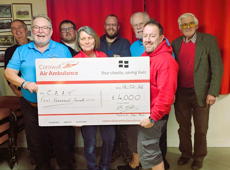Representatives from the Cornwall Air Ambulance Trust are presented with a cheque for £4,000, which was raised at the Dobwalls Beer Festival