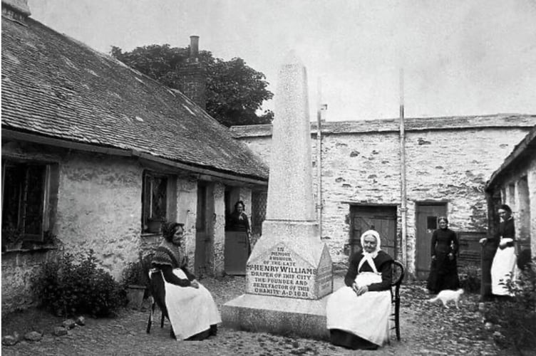 The memorial and almshouses pictured in the late 1890s