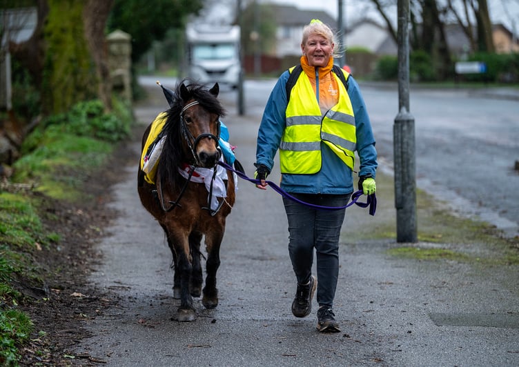 Carol Truscott and her horse 'Hope' out on their trek around St Austell showing their support for the people of Ukraine on the third anniversary of the war
