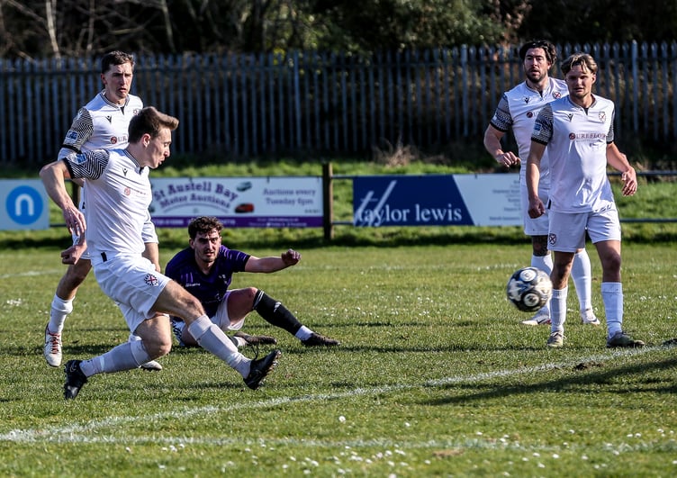Kieron Bishop puts St Austell ahead. Pictures by Paul Williams