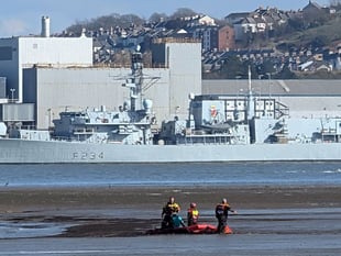 Multi-agency rescue of woman stuck waist deep on mud flats