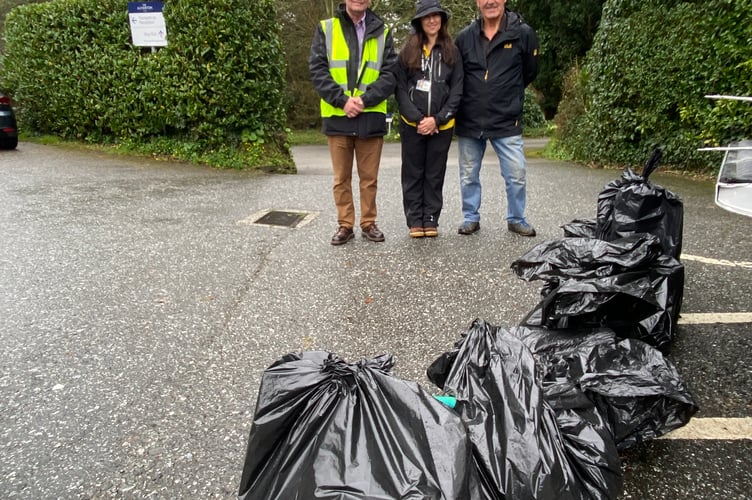 Alun Jones and Sian Knights from Truro BID with Paul Caruana and some of the rubbish collected at the Tregolls litter pick