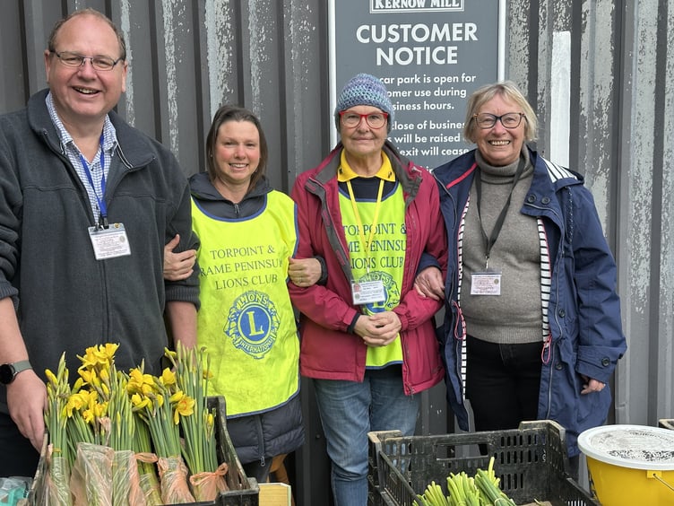 Volunteers from the Torpoint & Rame Peninsula Lions club selling daffodils at Kernow Mill