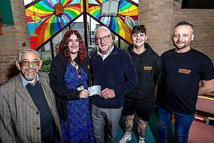 Church treasurer Christopher Sturley presents the cheque to Harbour Housing.