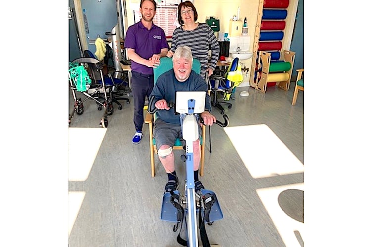 A client using the new therapy exercise bike.