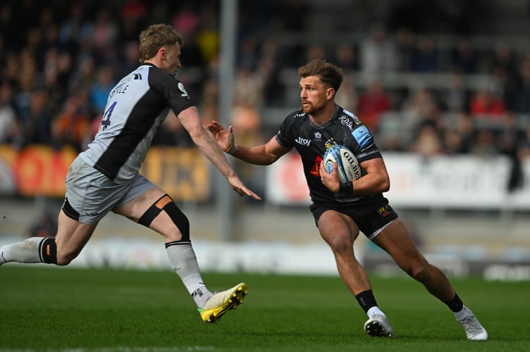 Exeter Chiefs centre Henry Slade comes under pressure from Newcastle Falcons winger Alex Hearle