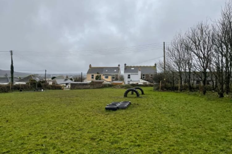 The dog exercising paddock and neighbouring houses.