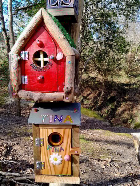 Two of John Rowe's fairy houses in Truro woodland
