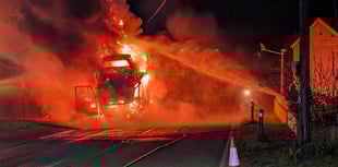 Firefighters tackle car transporter engulfed in flames