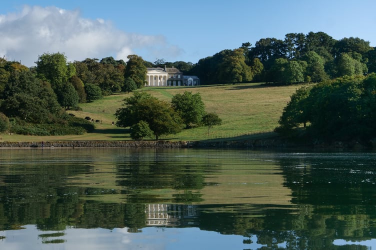 View up towards the house and parkland across the River Fal at Trelissick, Cornwall