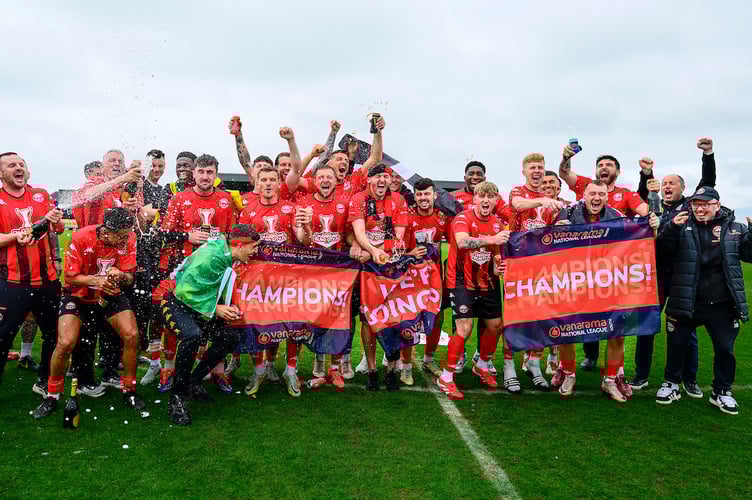 Truro City players and staff celebrate becoming National League South Champions after the National League South match between Truro City and St Albans City at Truro City Stadium on 26 April 2025  Photo: Phil Mingo/PPAUK