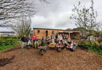 Volunteers chip in to help organisation move into its new premises