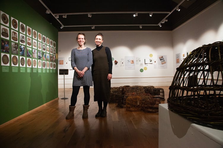 Artist Anna Pope (R) and Sarah Trevillion from Storylines at the Withy Lore exhibition.