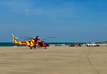 Injured surfer airlifted to hospital