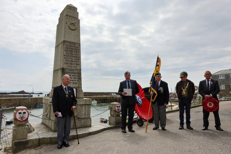 VE Day Ceremony organised by Mousehole Royal British Legion at the War Memorial in Mousehole.