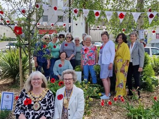 Inner Wheel turn flower bed into sea of knitted red poppies