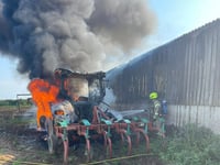 Firefighters prevent tractor fire spreading to nearby barn