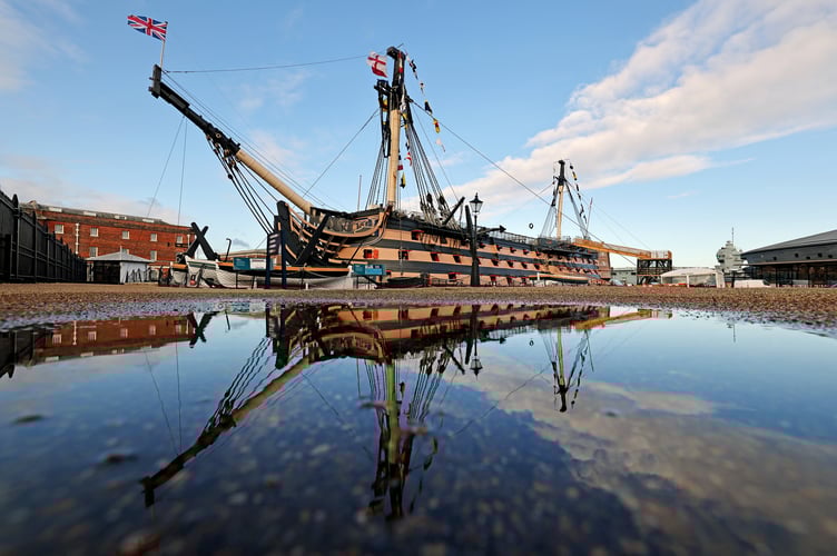 Pictured: A view of HMS Victory from HMNB Portsmouth showing the flag signal raised during the Battle of Trafalgar in 1805 "England Expects That Every Man Will Do His Duty" after the Trafalgar Day Ceremony held onboard.
Second Sea Lord, Vice Admiral Nick Hine CB, has led Trafalgar Day celebrations on board his Flagship, HMS Victory, marking todays 216th anniversary of the battle.
The Battle of Trafalgar changed the course of British history and sealed Royal Navy dominion of the seas for more than a hundred years.
Nelsons tactical genius in splitting the line of enemy ships had already set the pre-conditions for victory, when only an hour into the battle, Nelson was hit by a French sharpshooters musket ball as he paced Victorys quarterdeck, directing the battle.