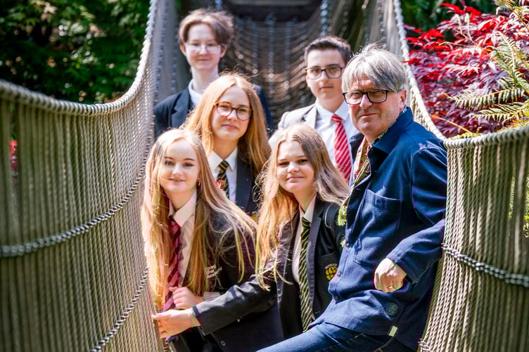 Poet laureate Simon Armitage with Cornish school pupils at the Lost Gardens of Heligan.