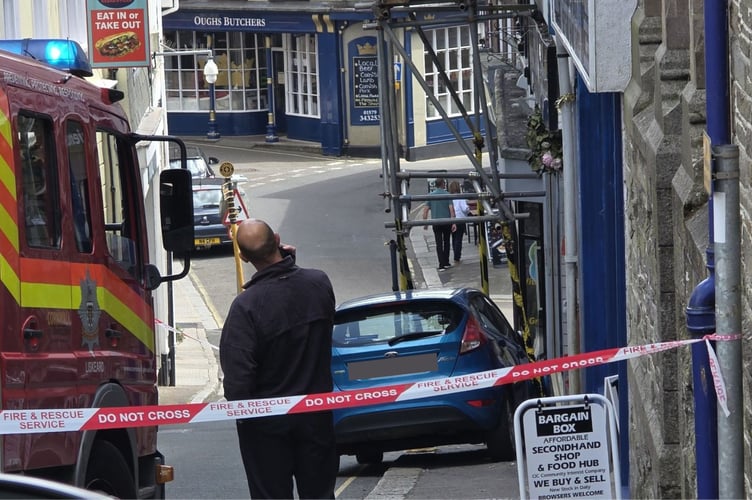 A blue Ford Fiesta collided with scaffolding around a building in Liskeard's Pike Street.