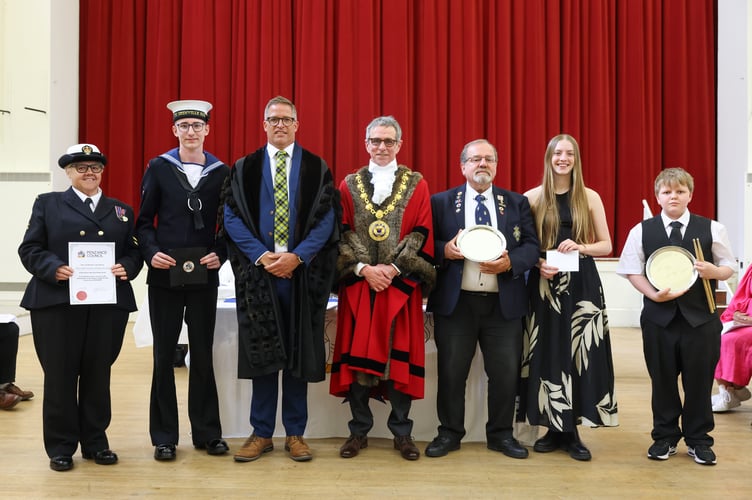 Petty Officer Juliet Scanlon, Mayorâs Cadet Thomas Kirk, Town Clerk James Hardy, Mayor of Penzance Stephen Reynolds, Citizen of the Year Vernon Durrant, Humphry Davy Prize winner Isla Mulholland, Young Citizen of the Year Jack James. The 45th Annual Mayor Choosing Ceremony of Penzance Council held in St John's Hall, Penzance, on Monday 19 May 2025. Photo by Penzance Council