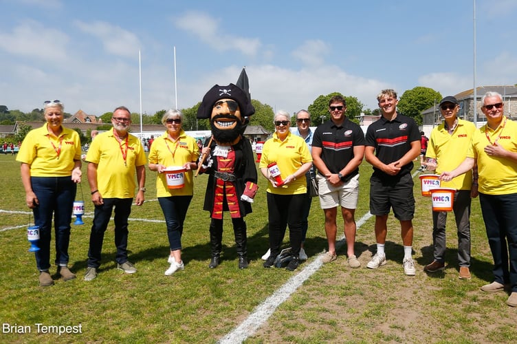 es. The YMCA collectors are pictured (Photo credit: Brian Tempest) with the Pirates mascot Captain Benbow and players Oisin Michel and Barnaby Elderkin.