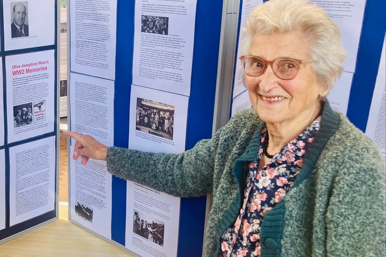 A lady who was an evacuee from London in WW2 points out information about her time spent in Madron.