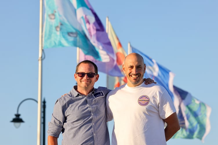 Vaughan and Adam from Sail Flags. Penzance Council's popular Promenade flags return, signalling the start of summer. Photo by Penzance Council