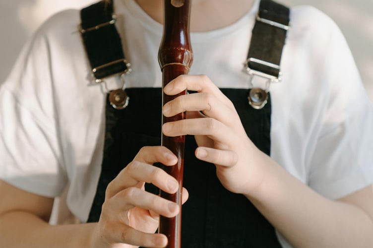 Child playing recorder