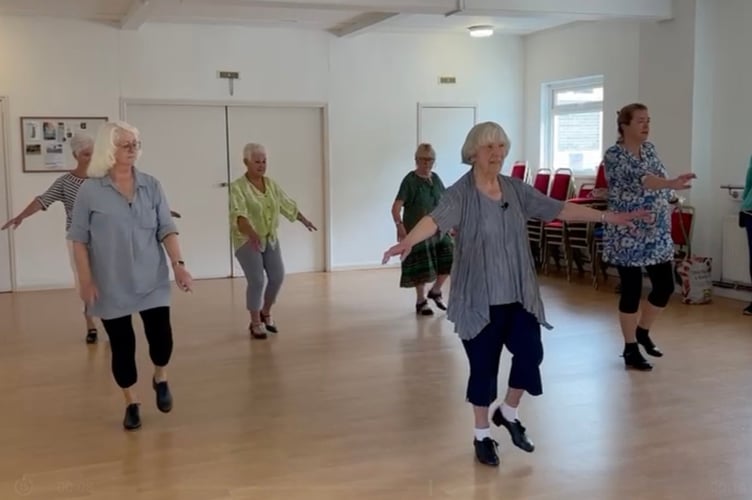Joy Saunders leads a tap dancing class. A woman is still teaching tap dancing at the age of 95 - despite having a heart problem and two hip replacements.  Joy Saunders has been tap dancing since she was eight and despite her age she is still teaching a class at Penzance YMCA each week. Tap dancing came into her life when she was advised by doctors to give it a try as she used to fall over "a lot" and so could help bringing strength to her legs. Despite her biggest passion being ballet she quickly became interested in tap dancing.  Over the decades Ms Saunders taught this style of dancing to many children at schools.