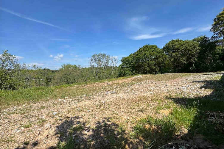 The land has planning permission for up to four homes.