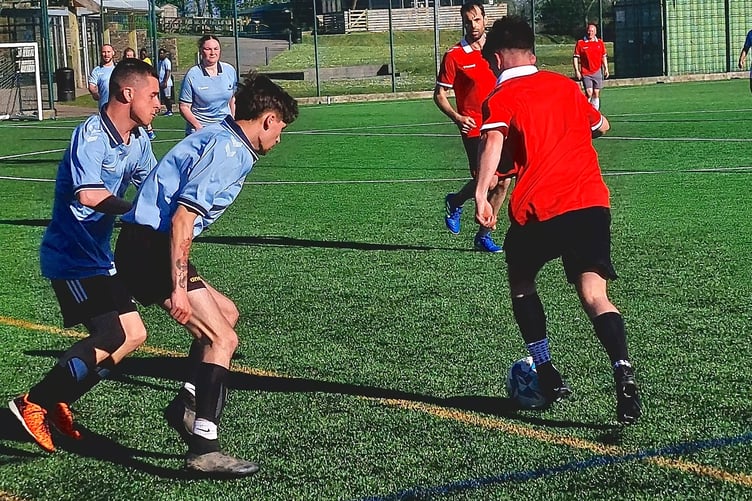 Action from the charity football match involving Imerys staff.