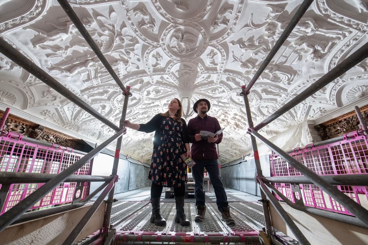 Two visitors on scaffolding to view the Long Gallery ceiling at National Trust Lanhydrock, Cornwall as part of the project to conserve the ceiling(C)National Trust Images_Steve Haywood