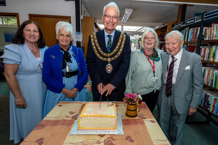 Mayor Colin Hamilton cuts the cake accompanied by library manager Terry Shaw, consort Maggie Hamilton, SALSA secretary Helen Barden and Peter Cornwell. Picture: Paul Williams