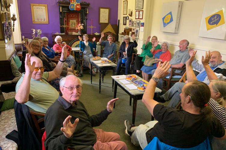 A friendly wave from members.