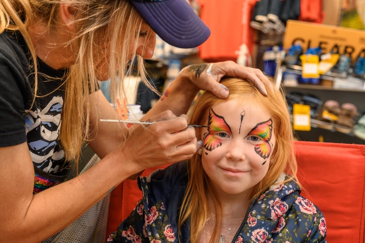 A facepainter at Children's Day in Truro