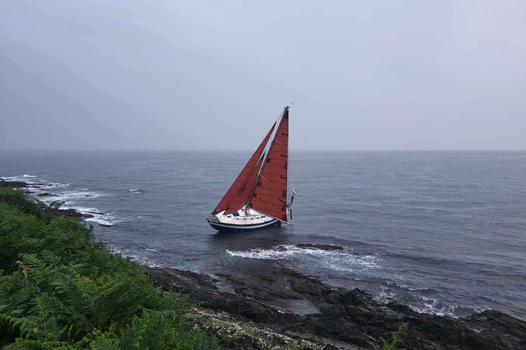 Misty Blue on rocks at Chapel Point on the Cornish coast. Picture: Mevagissey Coastguard