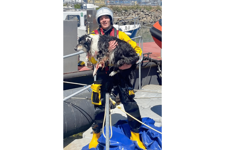 Penlee RNLI volunteer Max Rowe with Mac the dog back in 2022.