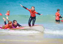 Military families enjoy surf lessons and coastal adventure