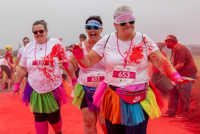 Runners covered in the colours of the rainbow for charity fun run