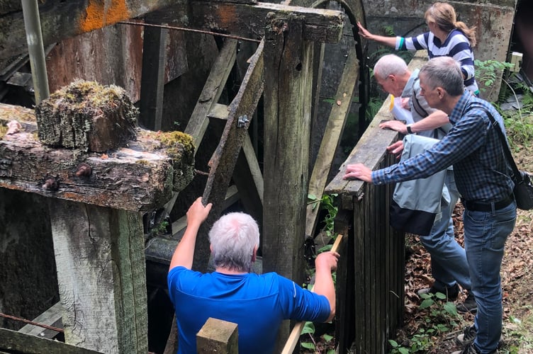 People attending the Protect Earth Summer Fair take part in a special history walk