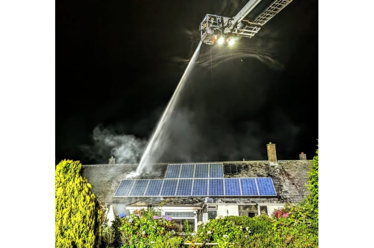 Firefighters using an aerial ladder deal with the incident at a property in Bodmin. Picture (St Dennis Community Fire Station).