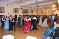 Students put on the style as they hold their prom