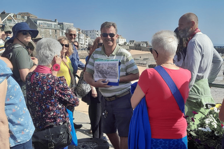TONY MASON (centre) conducting one of his walks at last year’s September Festival.