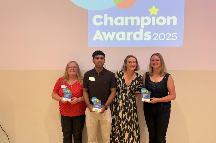 Toni Sheffield and Aryan Shah of Truro Foodbank collect the Joint Champions award with Rosy Povey and Nell Smirthwaite from Cornwall Council 