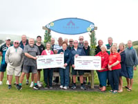 Golfers chip in £1,000 for charity