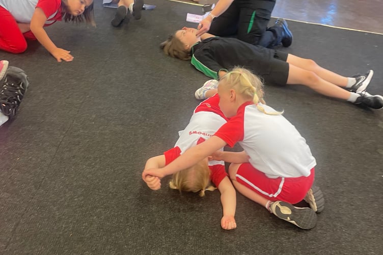 Working with St John Ambulance, these young Rainbows learn some basic first aid