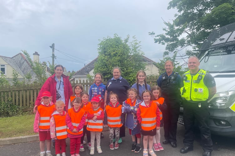 Members of the 1st Liskeard Rainbows on their visit to the town's police station