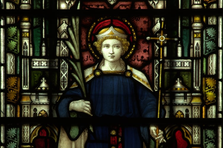 Alban holds a martyr's palm frond in a story window at Truro Cathedral